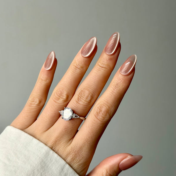 glossy nude press on nails long almond shimmer bridal nail design luxury