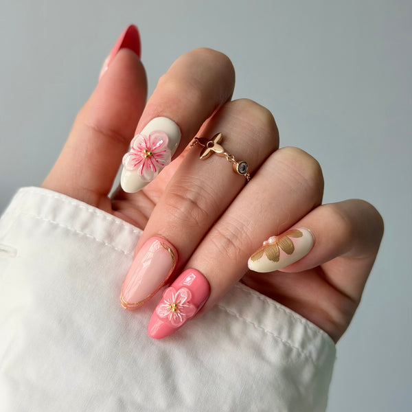 Blush almond press-on nails with 3D cherry blossom luxury bridal nail style