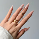 Glossy nude pink press-on nails almond shape crystal accent elegant everyday manicure