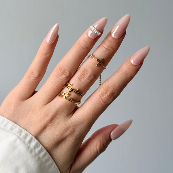 Glossy nude pink press-on nails almond shape crystal accent elegant everyday manicure