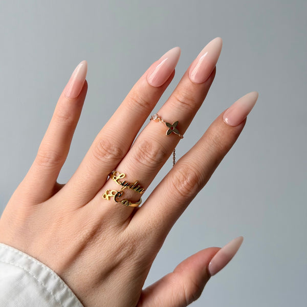 Glossy blush pink press-on nails almond shape minimalist luxury everyday manicure style