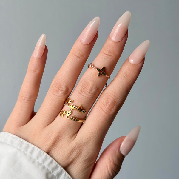 Glossy milky pink press-on nails almond shape minimalist luxury everyday manicure style