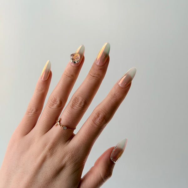 glossy nude press on nails almond shape aurora chrome finish gemstone detail wedding look