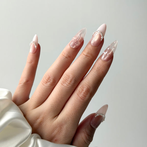 nude ivory press on nails almond glossy pearl bow design elegant bridal style