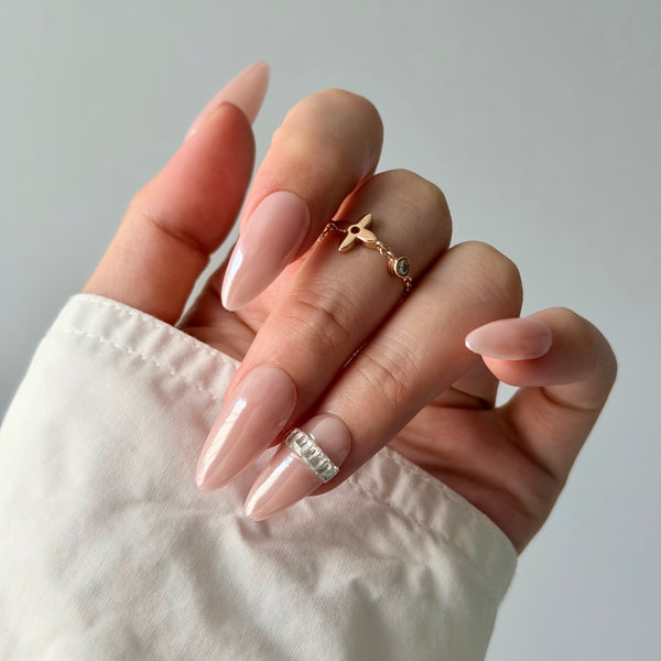 Blush almond press-on nails with silver rhinestone design luxury bridal nail style
