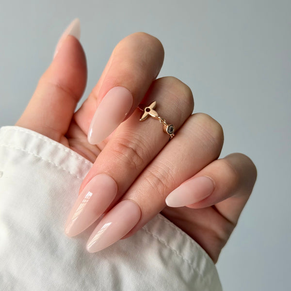 Soft nude almond press-on nails glossy finish elegant bridal wearable nail design
